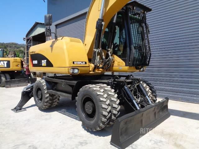 CAT M 318 D Pelle sur pneus