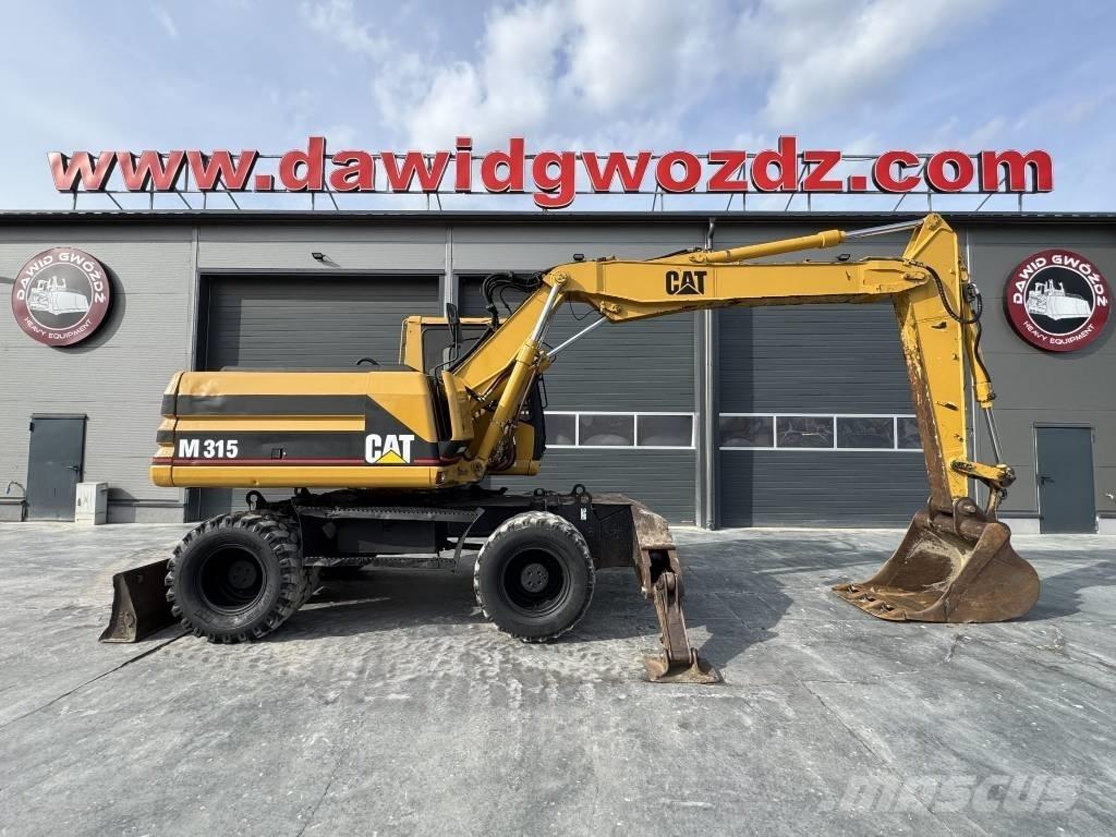 CAT M 315 Pelle sur pneus