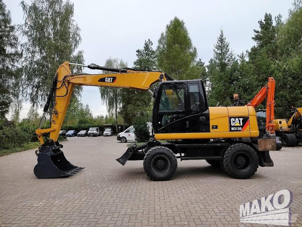CAT M 313 D Pelle sur pneus
