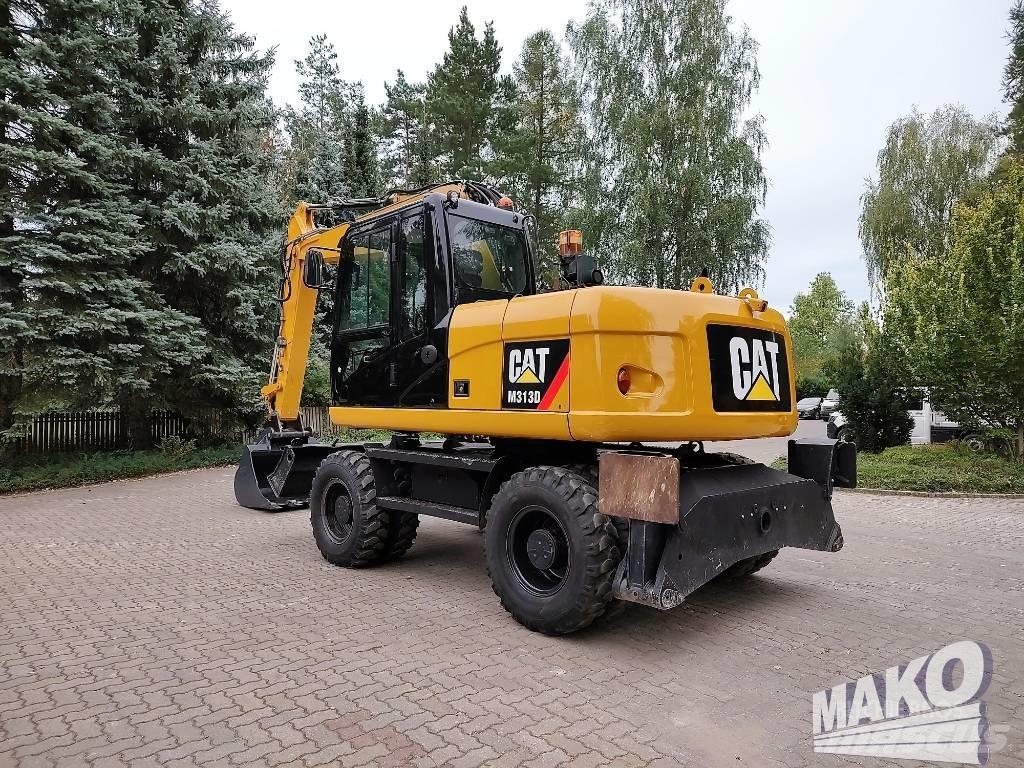CAT M 313 D Pelle sur pneus