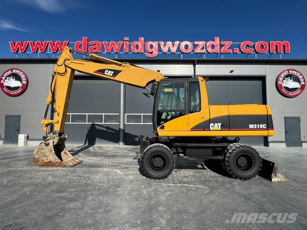 CAT M 318 C Pelle sur pneus