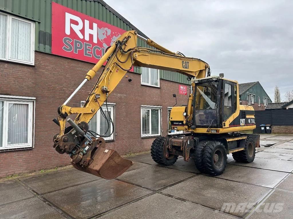 CAT M315 +ROTO CE Pelle sur pneus