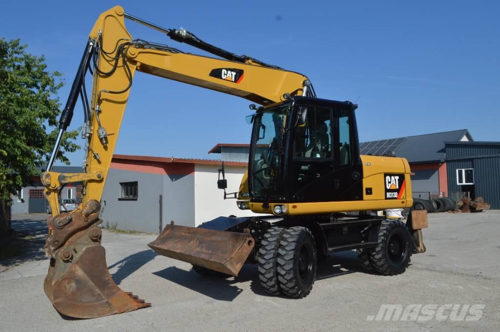 CAT M 313 D Pelle sur pneus