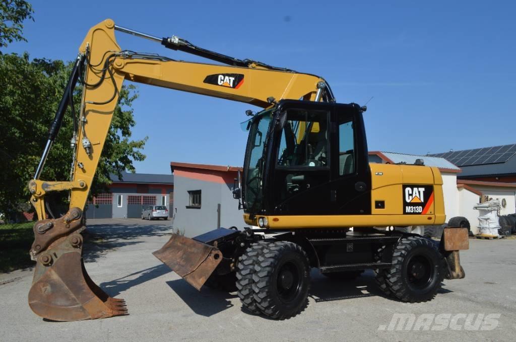 CAT M 313 D Pelle sur pneus
