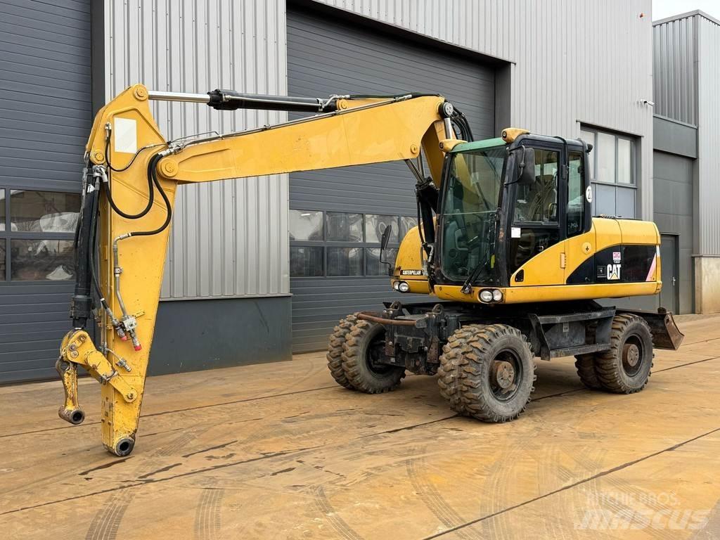CAT M315D Pelle sur pneus