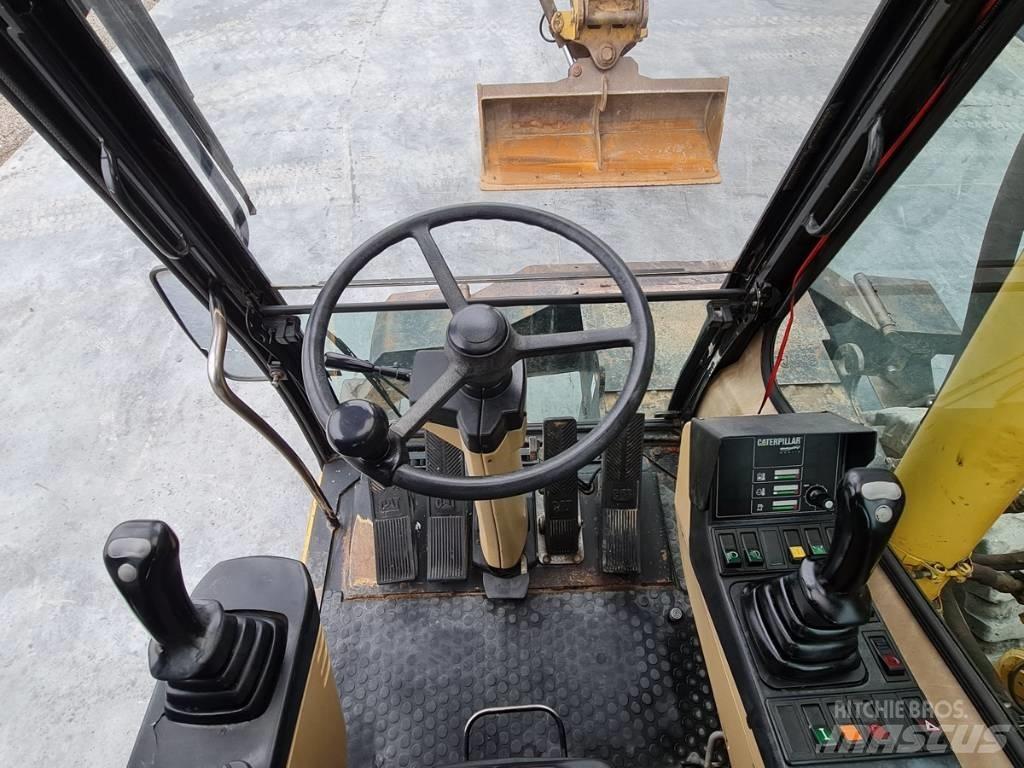 CAT M 312 Pelle sur pneus
