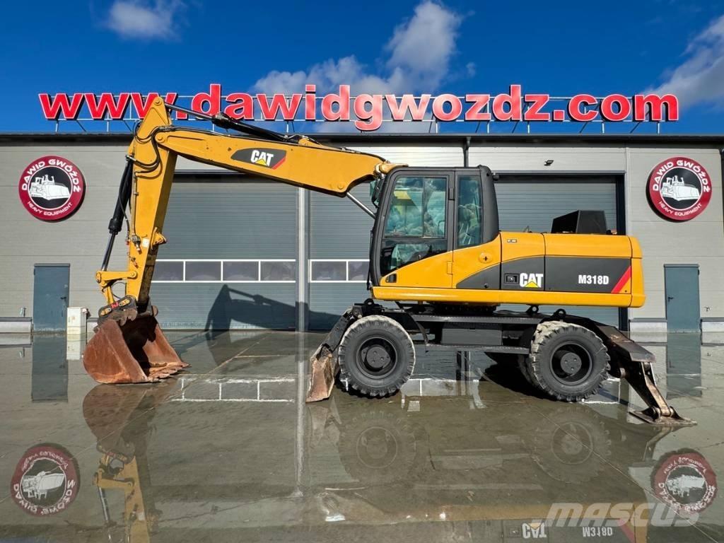 CAT M 318 D Pelle sur pneus