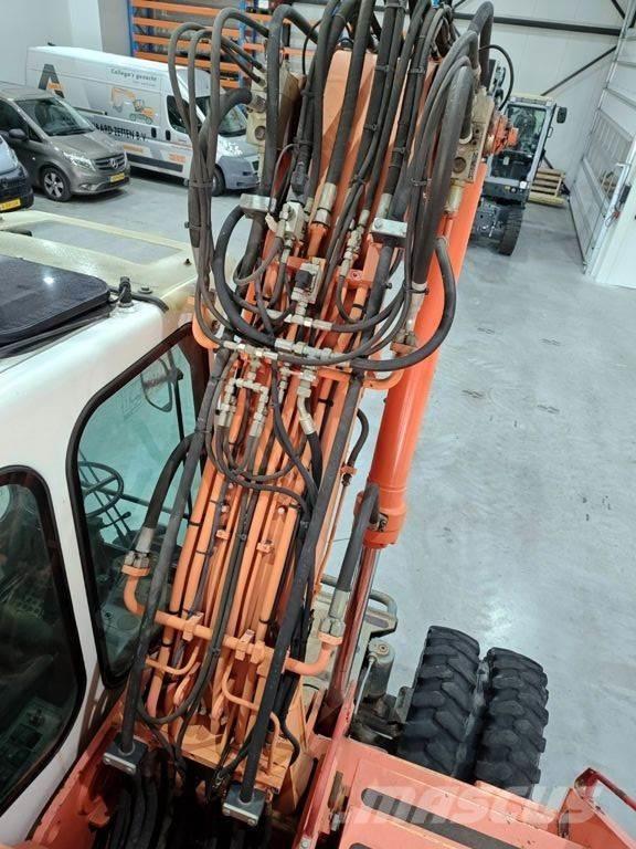 Atlas 1404 Pelle sur pneus