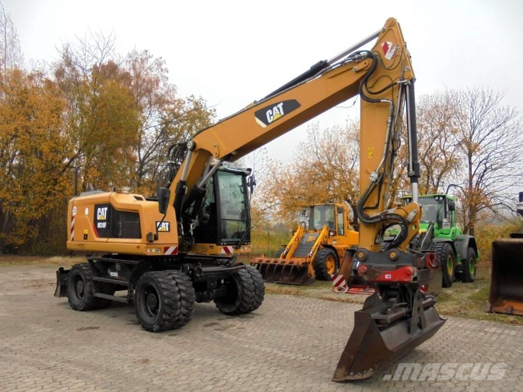 CAT M 318 F Pelle sur pneus