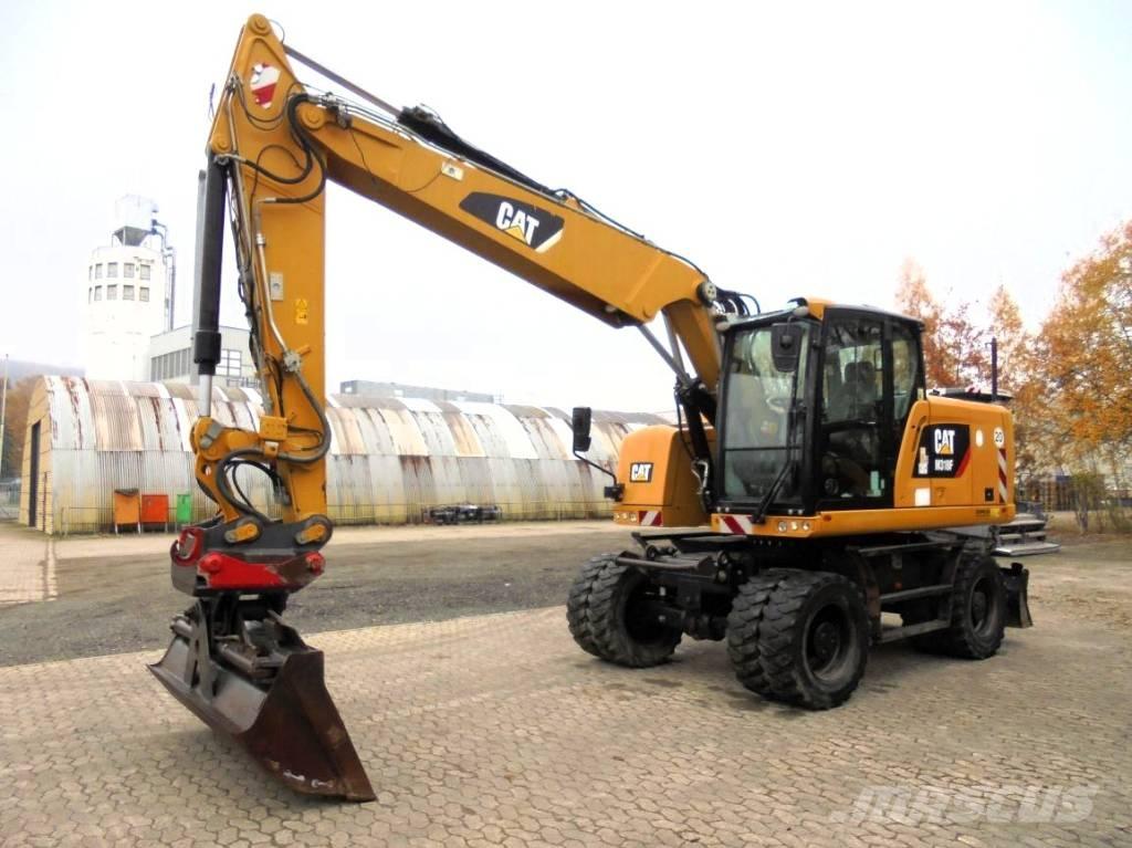 CAT M 318 F Pelle sur pneus