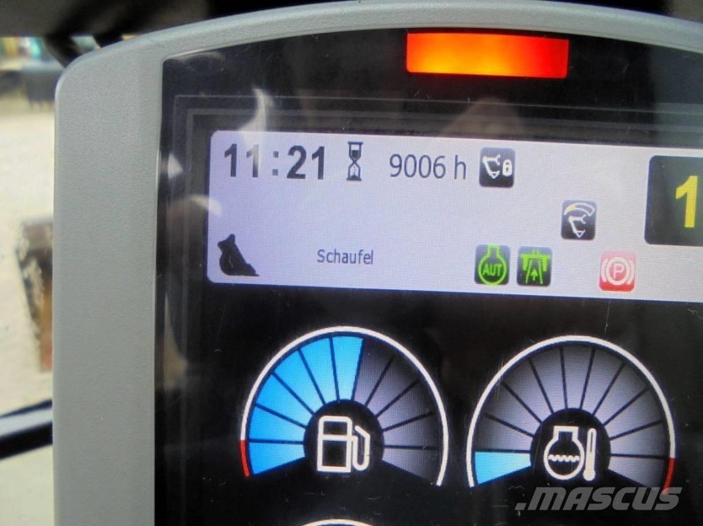 CAT M 318 F Pelle sur pneus