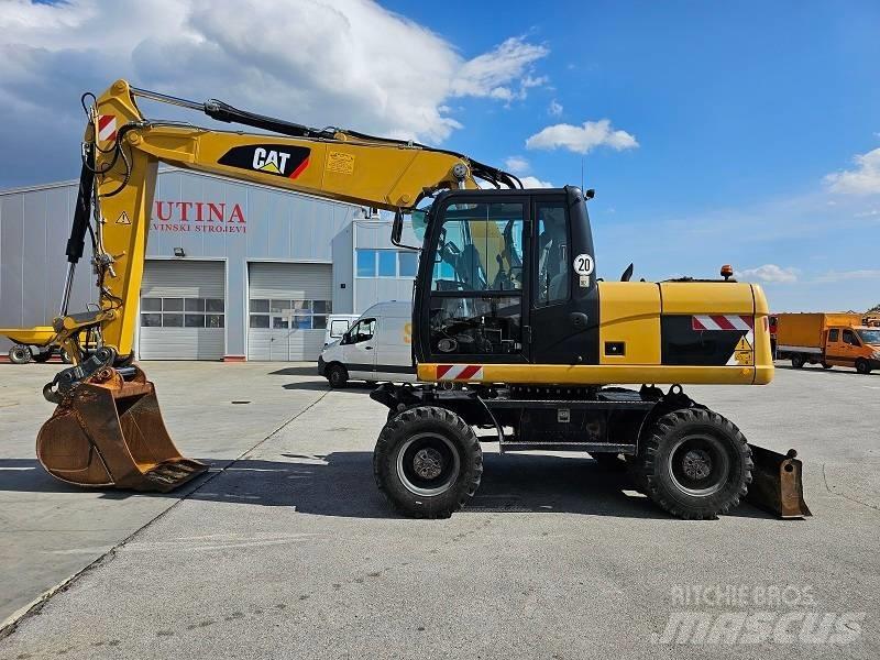 CAT M 315 D Pelle sur pneus