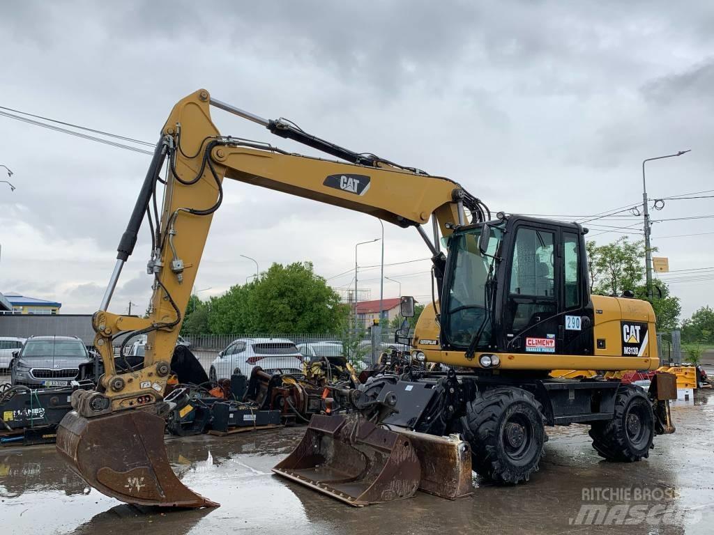 CAT M 313 D Pelle sur pneus