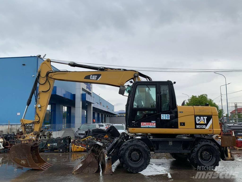 CAT M 313 D Pelle sur pneus