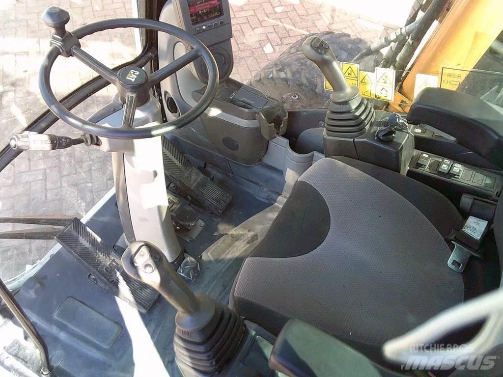 CAT M313D Pelle sur pneus