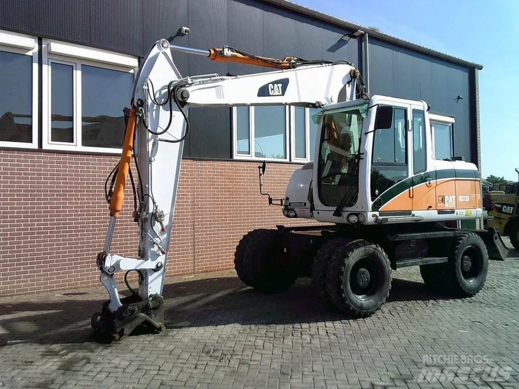 CAT M313D Pelle sur pneus