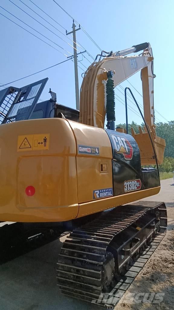CAT 313 D Pelle sur pneus