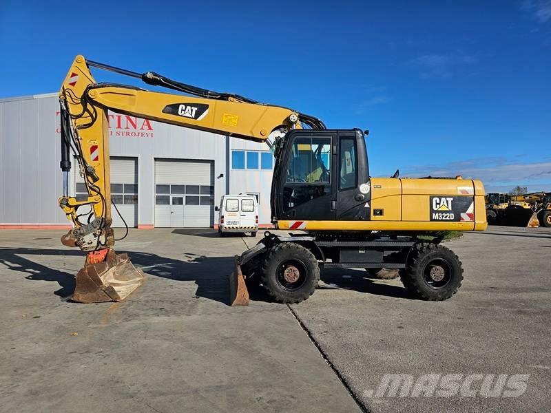 CAT M 322 D Pelle sur pneus
