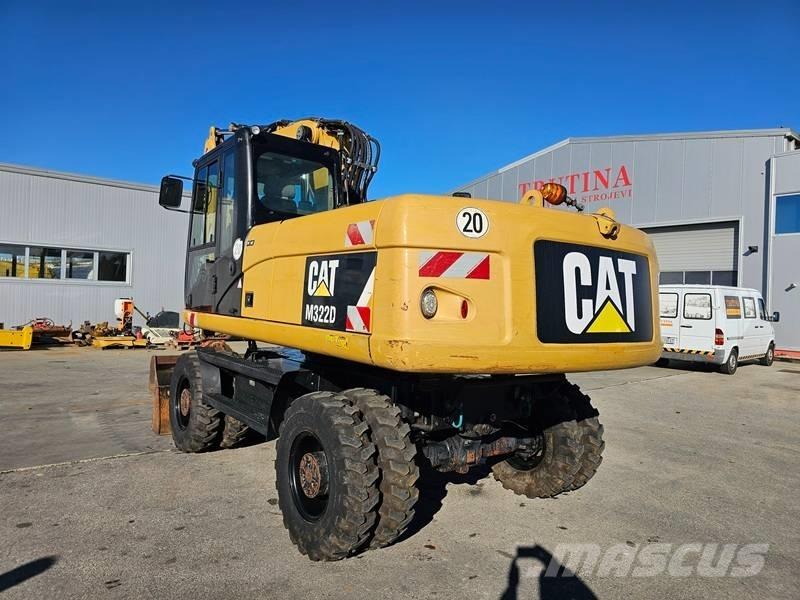 CAT M 322 D Pelle sur pneus