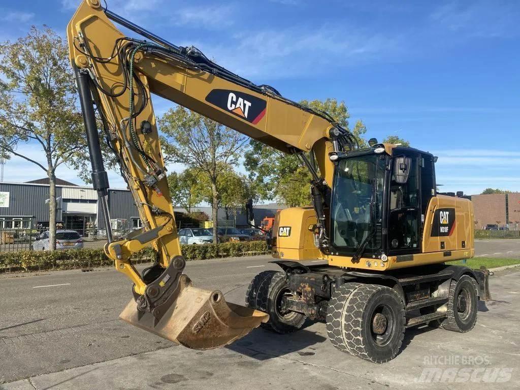 CAT M318F Pelle sur pneus