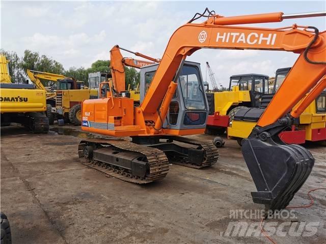Hitachi EX60 Pelle sur chenilles
