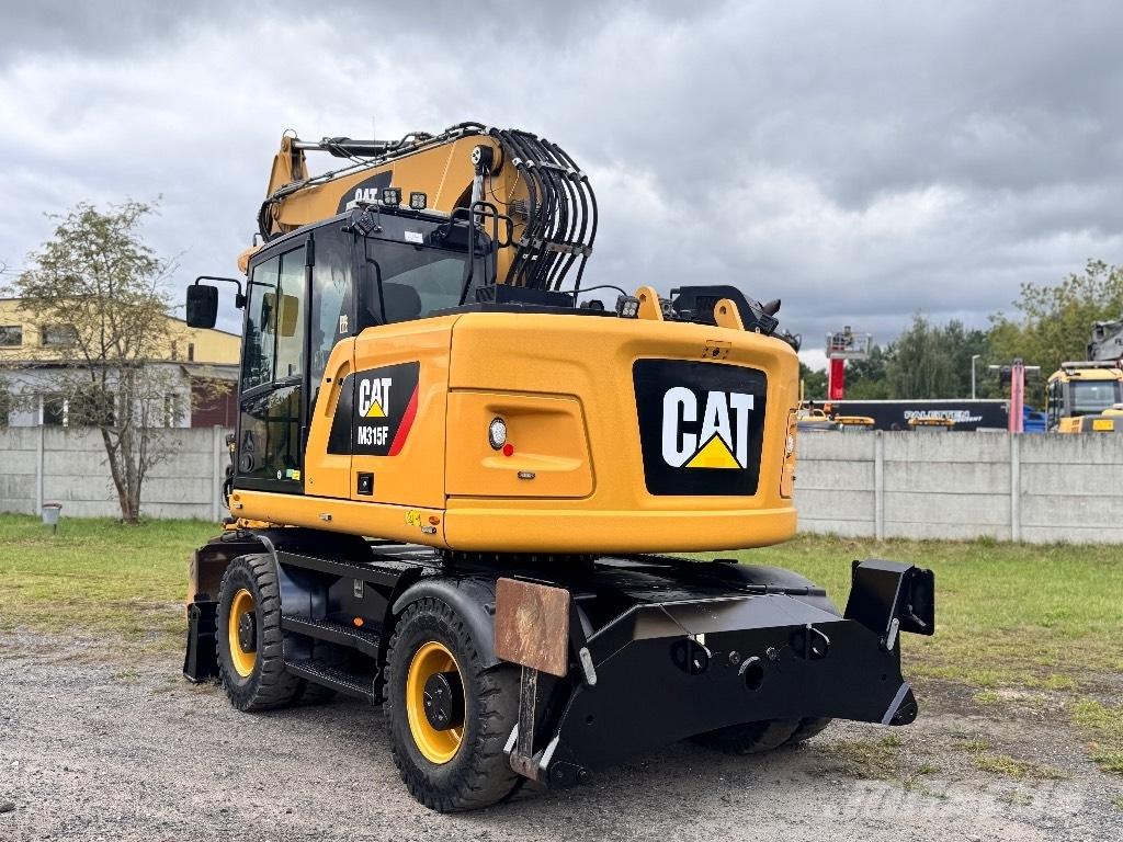 CAT M315F Pelle sur pneus