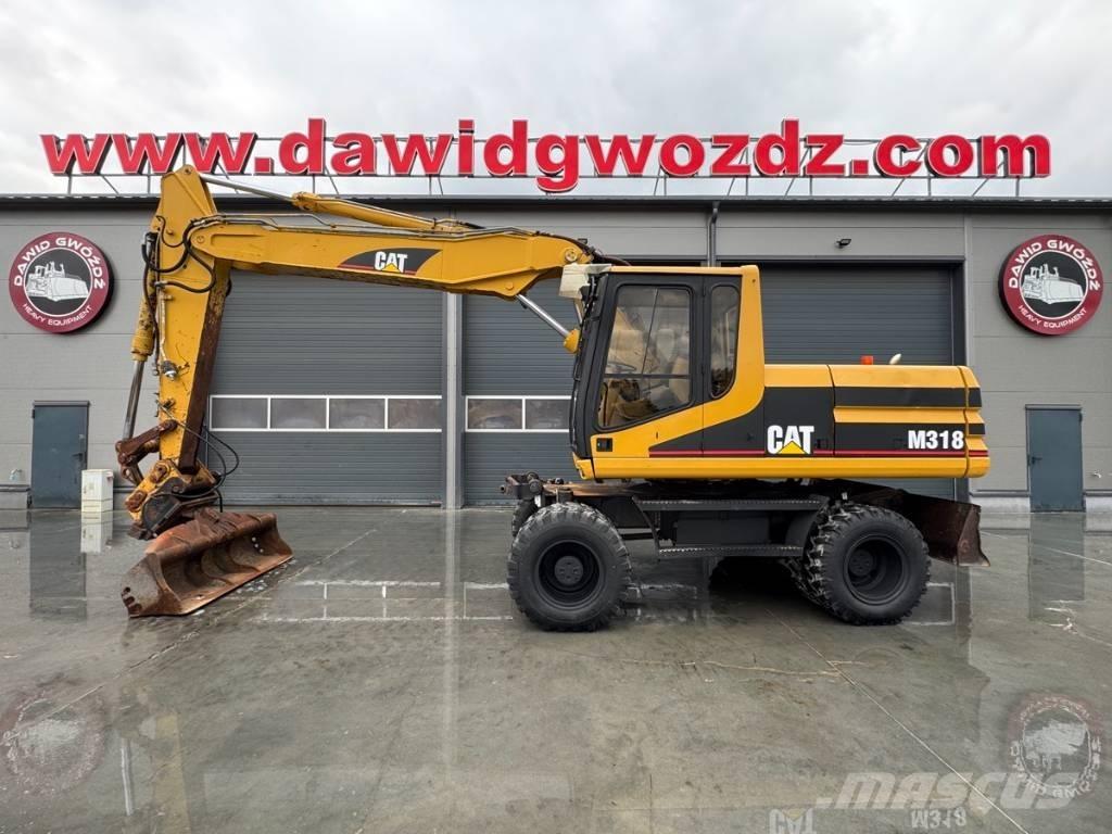 CAT M 318 Pelle sur pneus