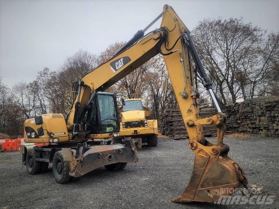 CAT M 315 D Pelle sur pneus