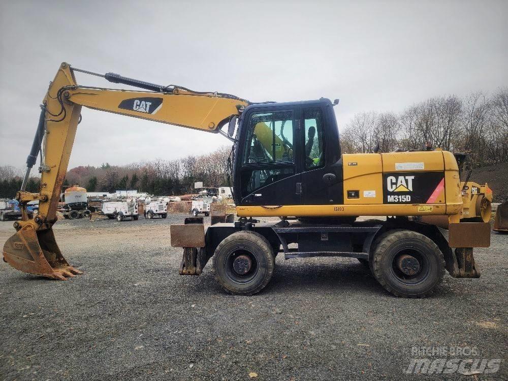 CAT M 315 D Pelle sur pneus
