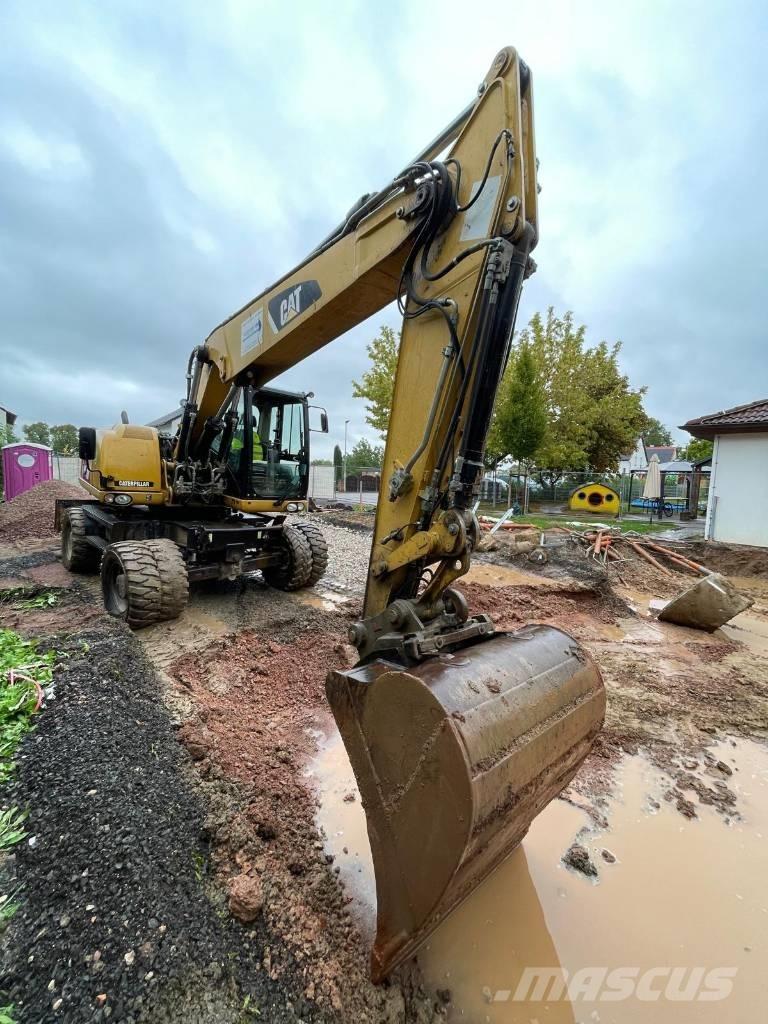 CAT 316 D Pelle sur pneus