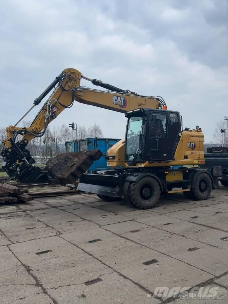 CAT M 319 Pelle sur pneus