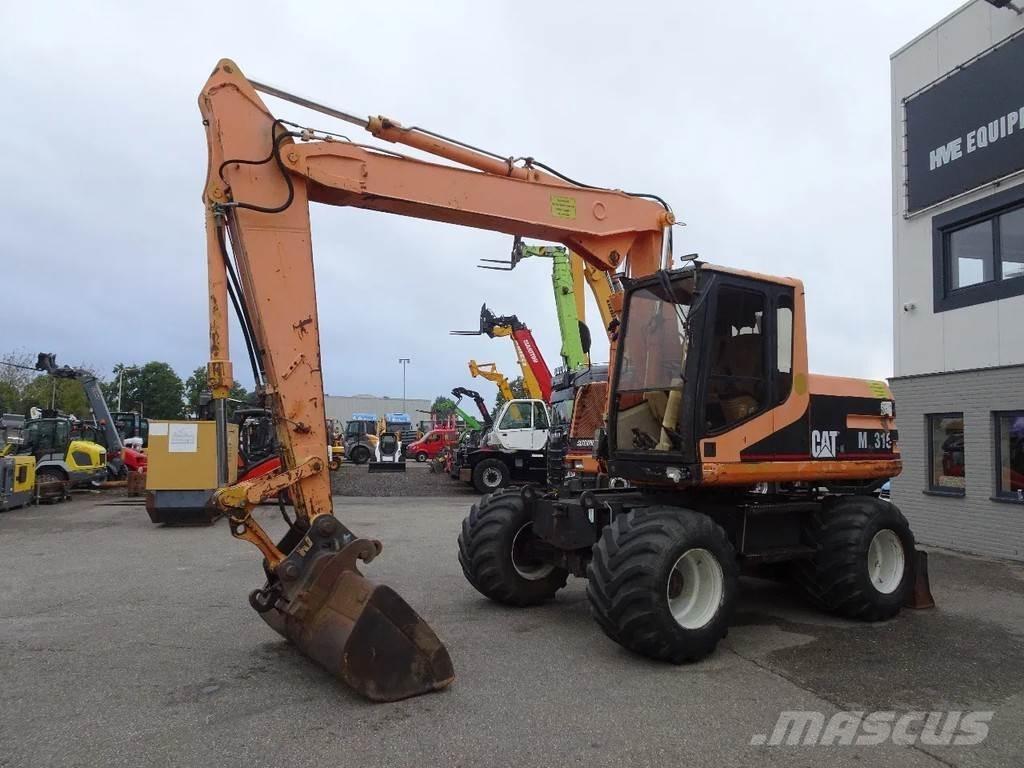 CAT M315 Pelle sur pneus