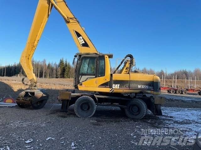 CAT M 322 C MH Pelle sur pneus