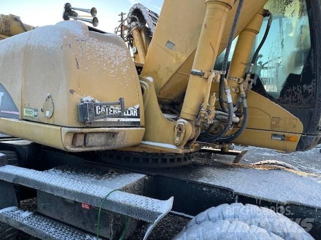 CAT M 322 C MH Pelle sur pneus