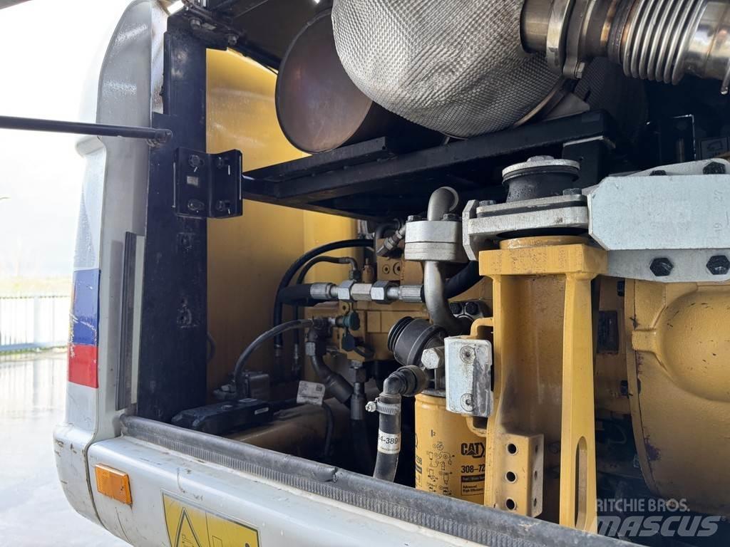 CAT M315D Pelle sur pneus