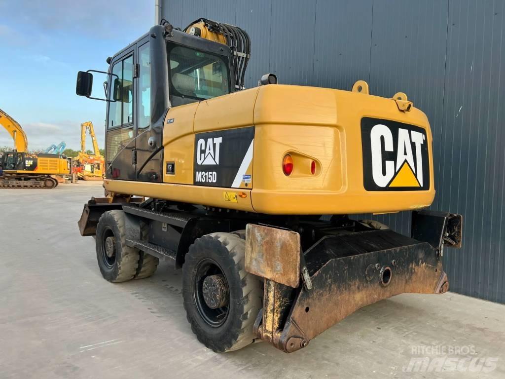 CAT M315D Pelle sur pneus