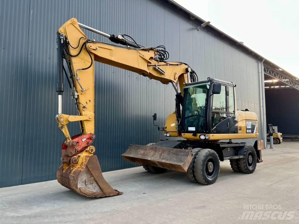 CAT M315D Pelle sur pneus