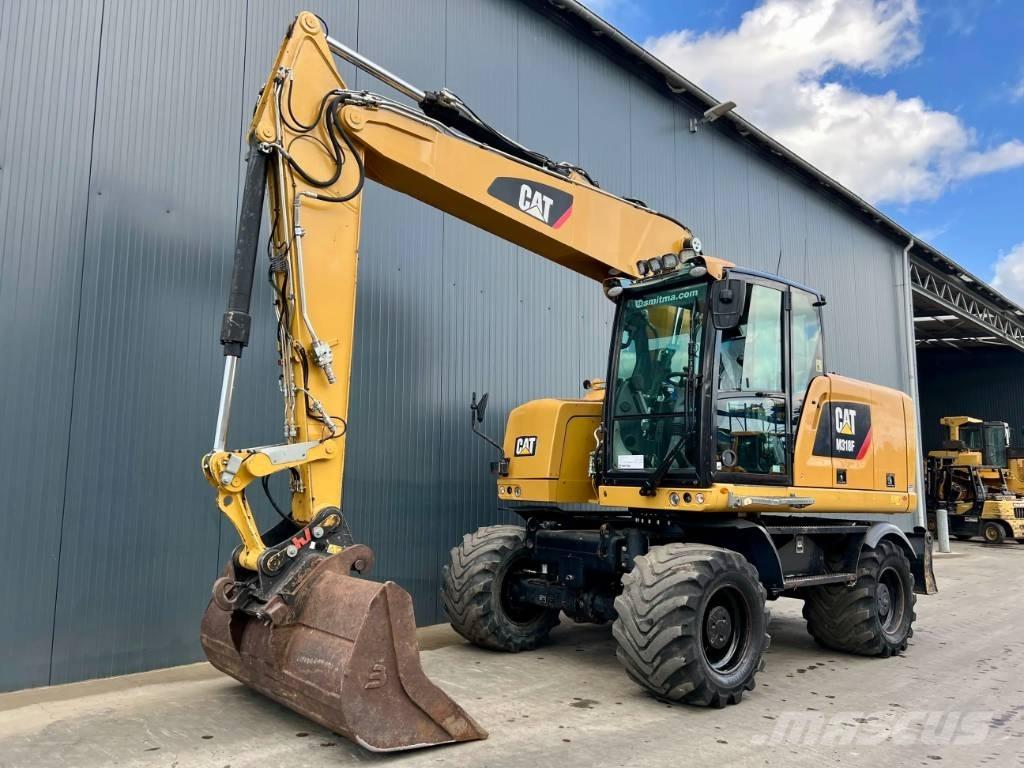 CAT M318F Pelle sur pneus