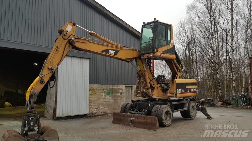 CAT M 318 Pelle à déchets