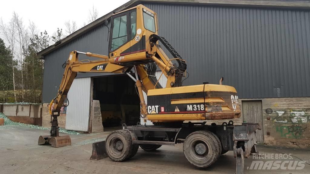 CAT M 318 Pelle à déchets