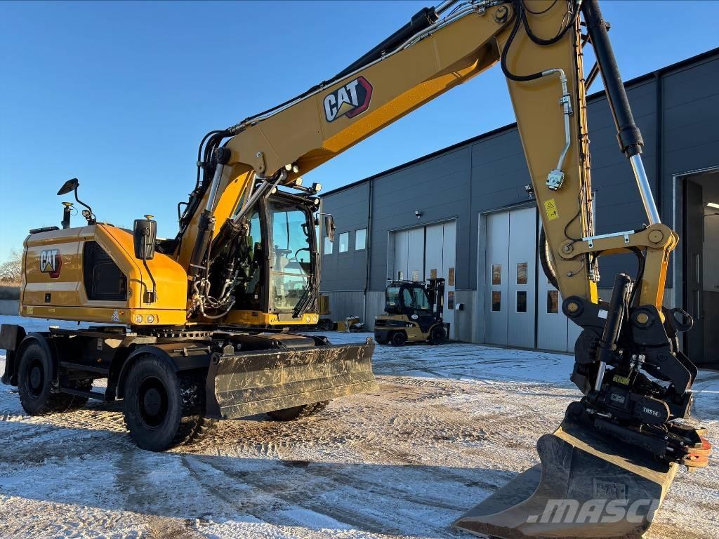 CAT M318 Pelle sur pneus
