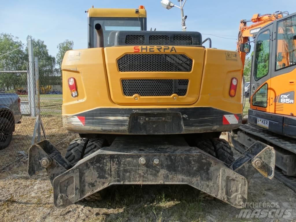 Sherpa EX70-4 Pelle sur pneus