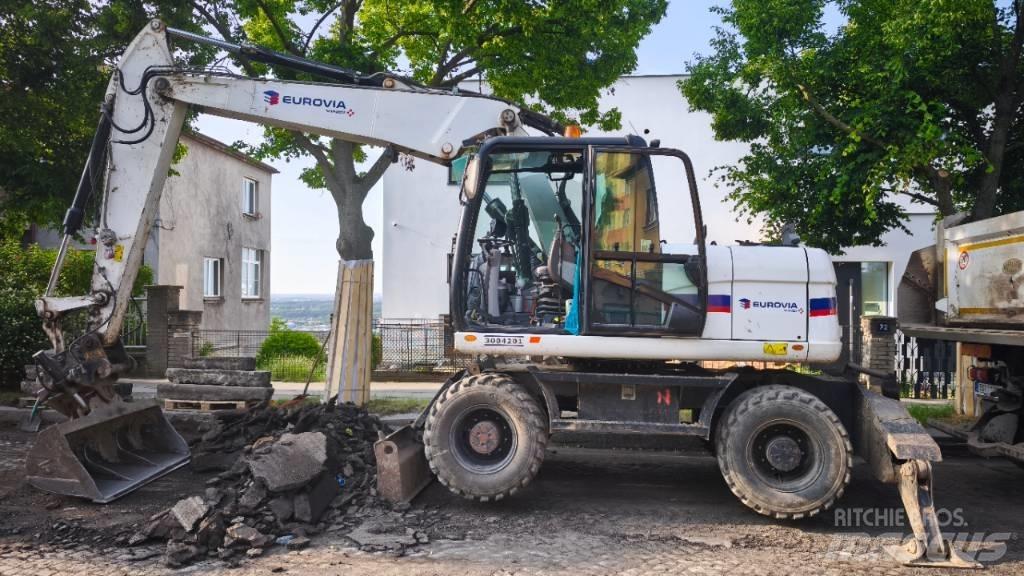 CAT 313 D Pelle sur pneus