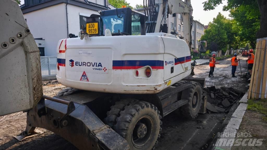 CAT 313 D Pelle sur pneus
