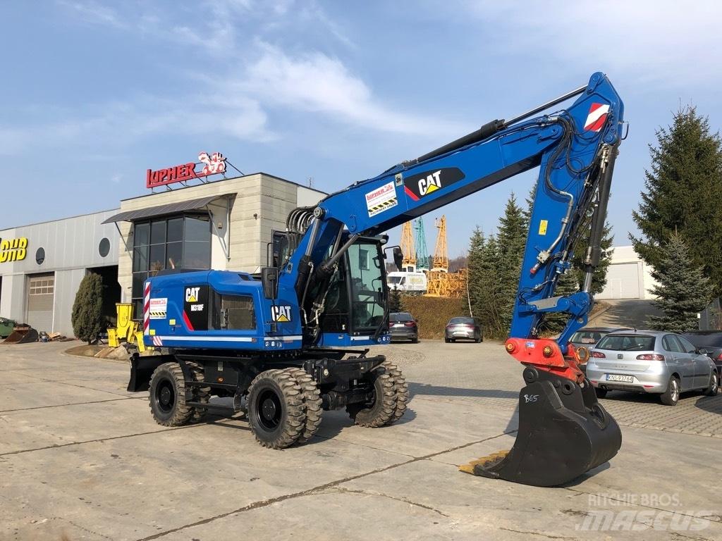 CAT M 318 F Pelle sur pneus