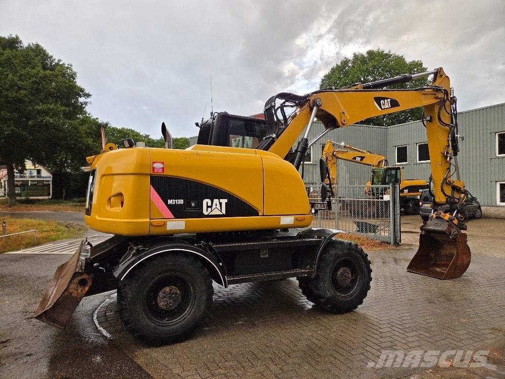 CAT M313D Pelle sur pneus