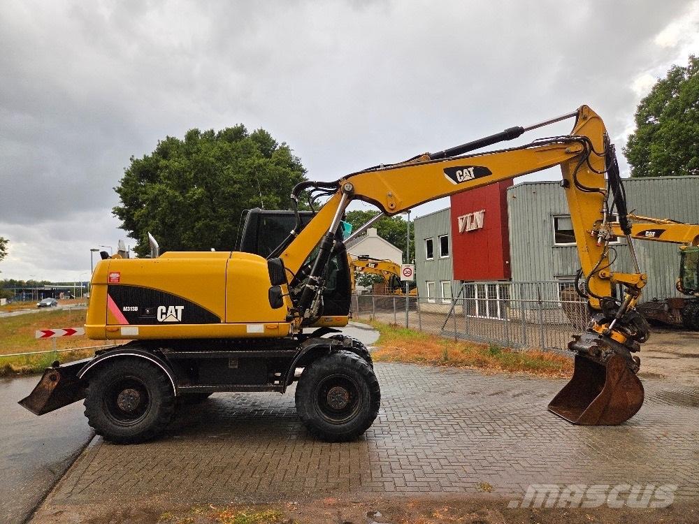 CAT M313D Pelle sur pneus