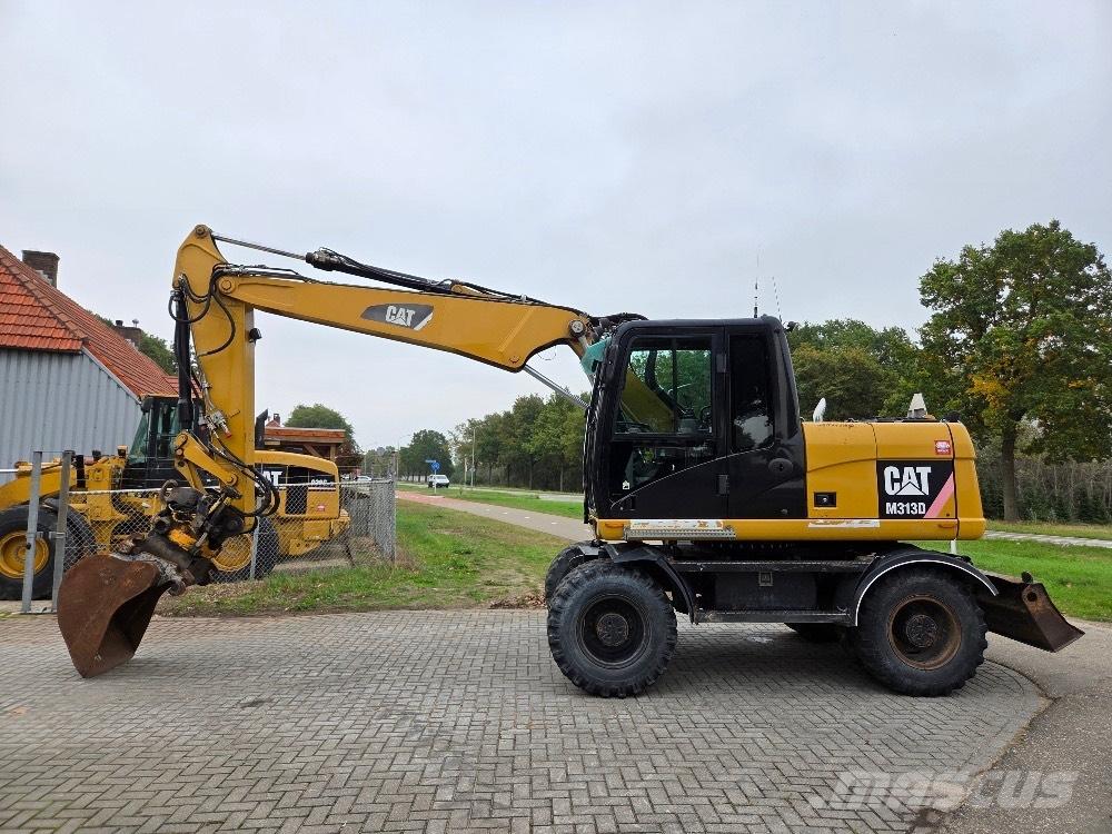 CAT M313D Pelle sur pneus