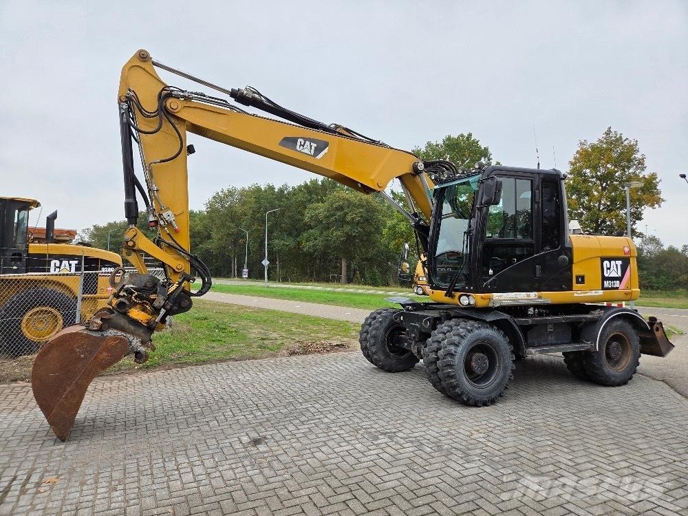 CAT M313D Pelle sur pneus