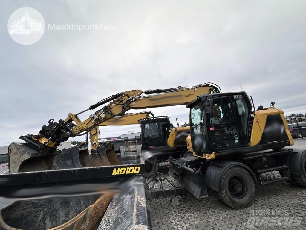 CAT M 315 Pelle sur pneus